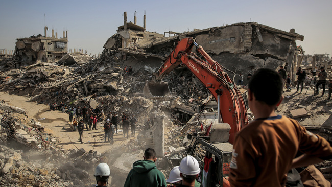 Civil defense teams recover bodies after Israeli attacks in Beit Lahia, Gaza
