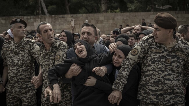 Funeral ceremony held for 13 security personnel killed in Israeli strike near a government complex and a State Security office