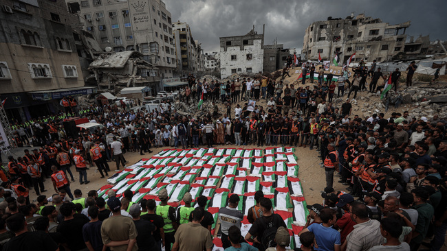 Gaza holds mass burial for more than 100 Palestinians recovered from Yarmouk rubble